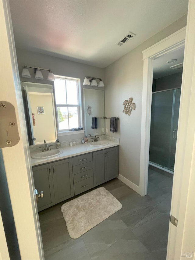 bathroom with an enclosed shower and vanity