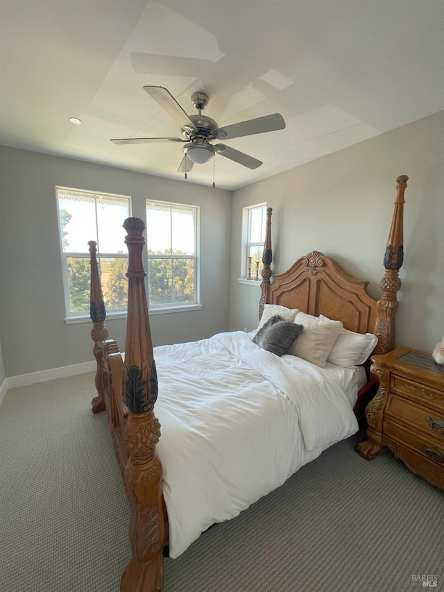 bedroom with ceiling fan and carpet floors