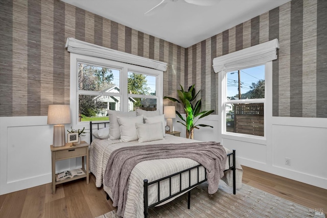 bedroom featuring ceiling fan and wood-type flooring