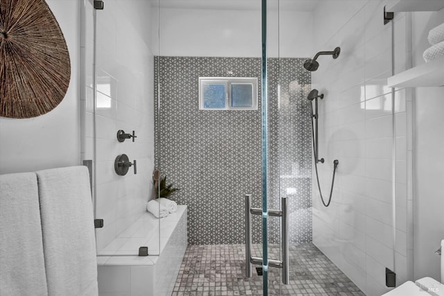 bathroom with a shower with shower door