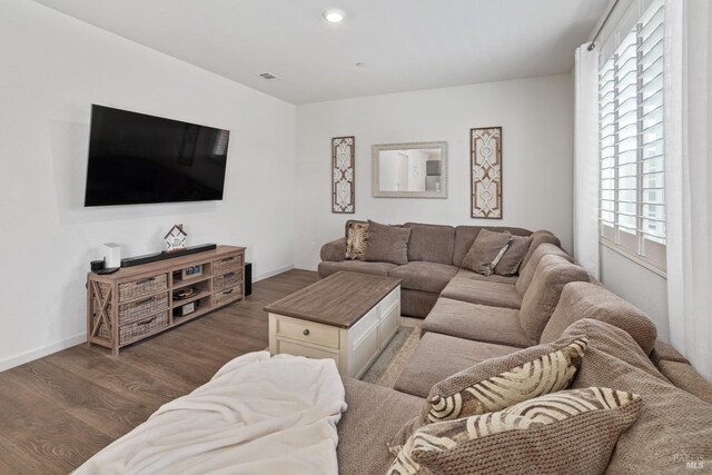 living room with dark hardwood / wood-style floors