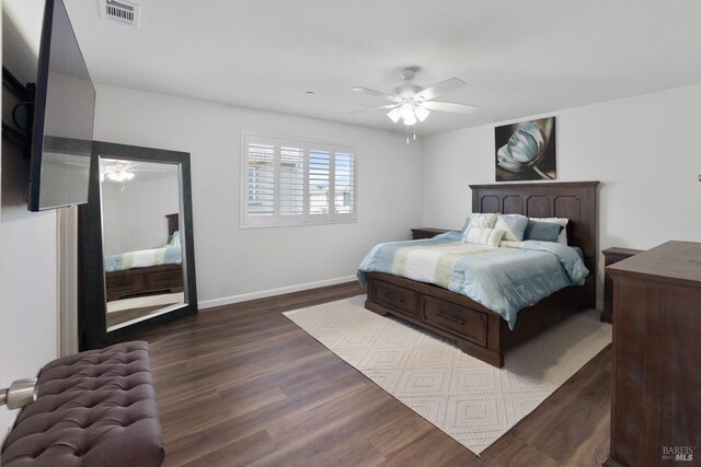 bedroom featuring dark wood-type flooring and ceiling fan