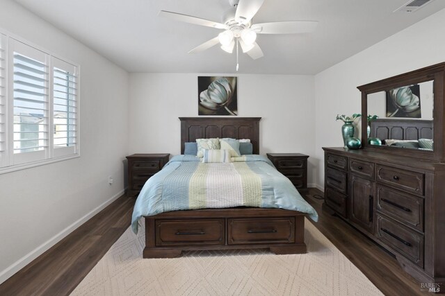 bedroom featuring ceiling fan and dark hardwood / wood-style flooring