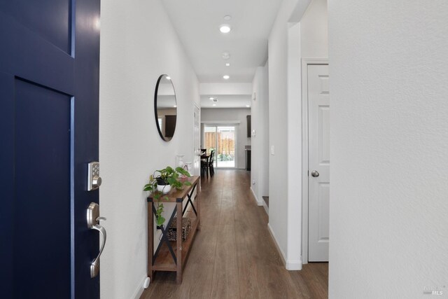 hallway featuring dark hardwood / wood-style floors