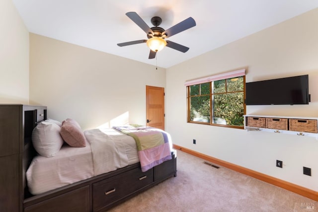 bedroom with light carpet and ceiling fan