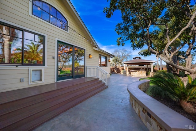 view of home's exterior featuring a gazebo and a patio