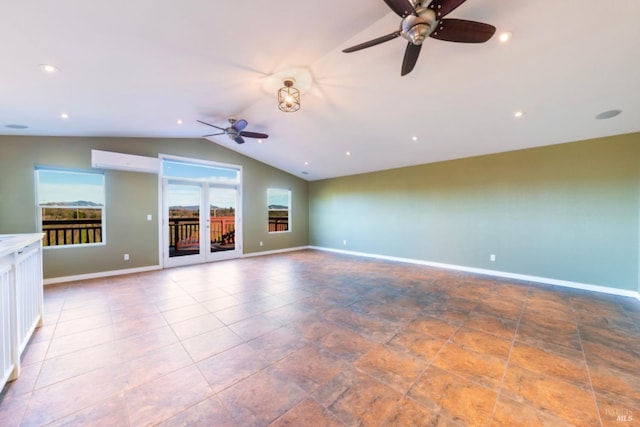 unfurnished living room with ceiling fan and lofted ceiling