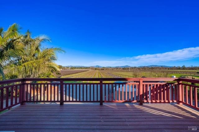 wooden terrace with a rural view