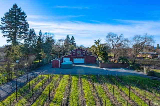 view of yard featuring a rural view and an outdoor structure