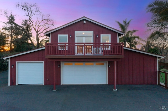 view of front property featuring a wooden deck and a garage