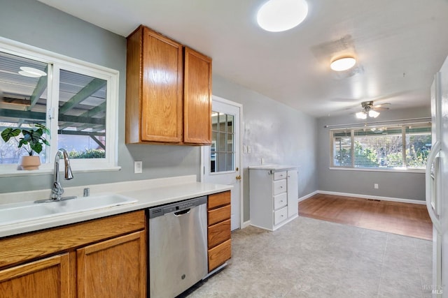 kitchen featuring sink, ceiling fan, and stainless steel dishwasher