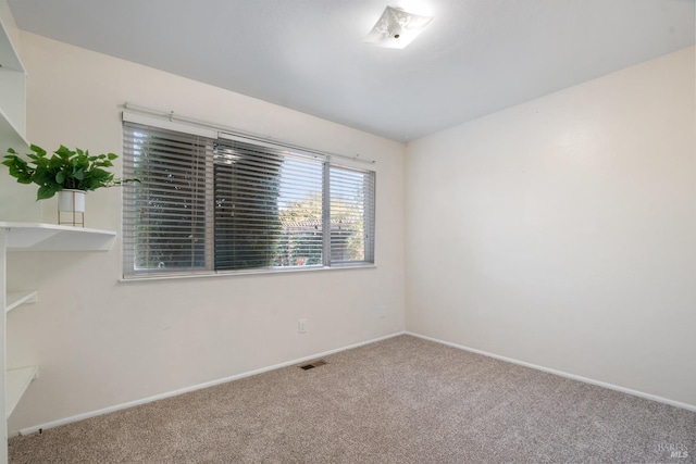 unfurnished room with carpet flooring