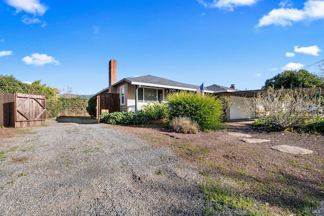 view of side of home with a garage