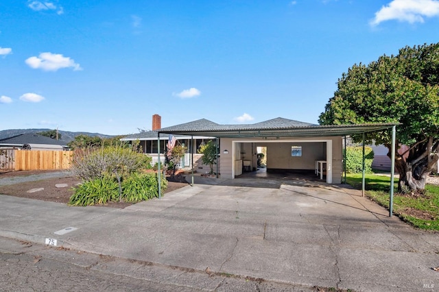 view of front of property featuring a carport