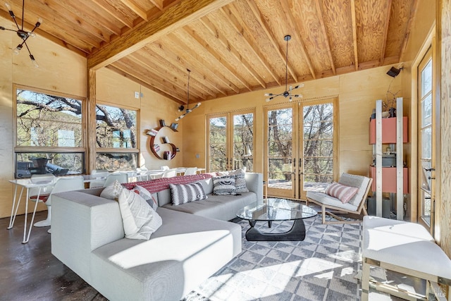 living room with vaulted ceiling with beams and french doors