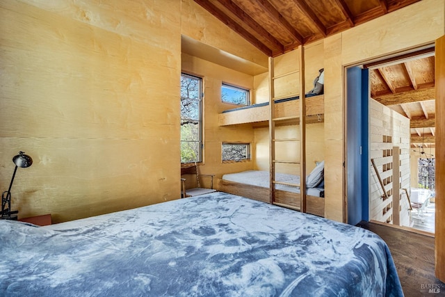 bedroom with wooden ceiling, a closet, and vaulted ceiling with beams