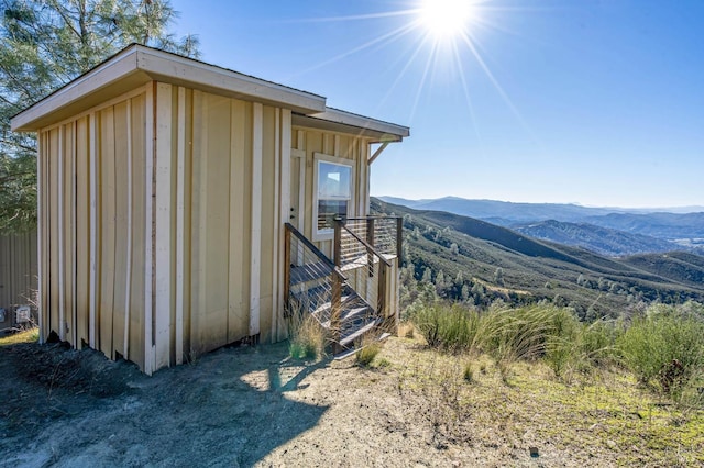 view of outbuilding with a mountain view