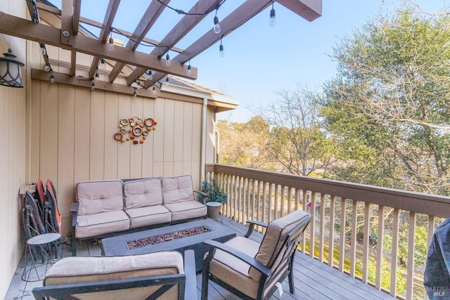 deck with an outdoor hangout area and a pergola