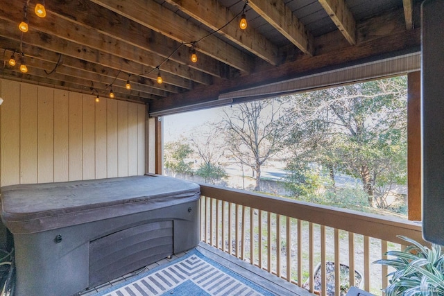 deck featuring a hot tub