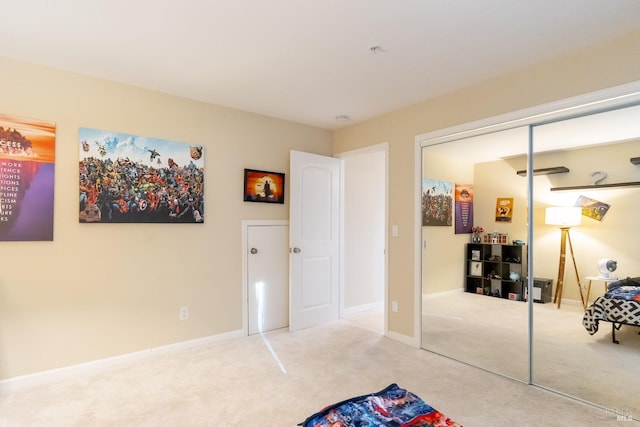 carpeted bedroom featuring a closet