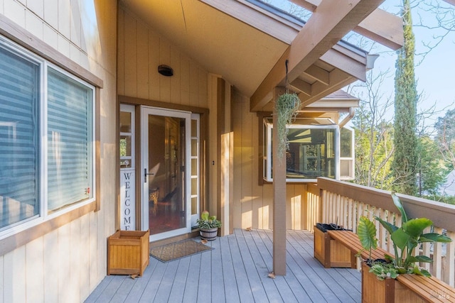 wooden terrace with a sunroom