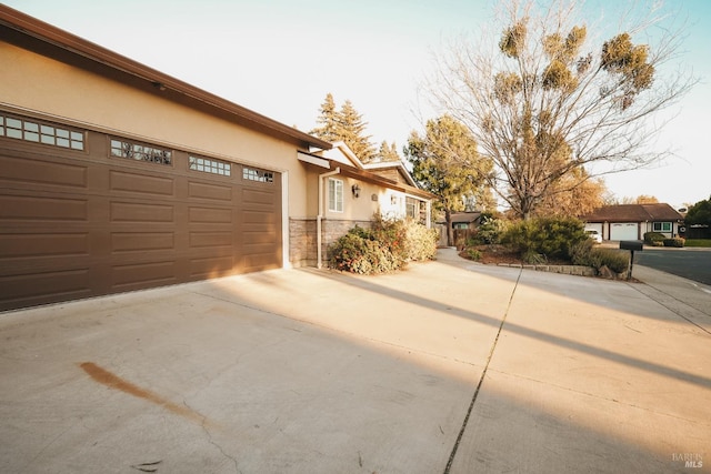 view of property exterior featuring a garage