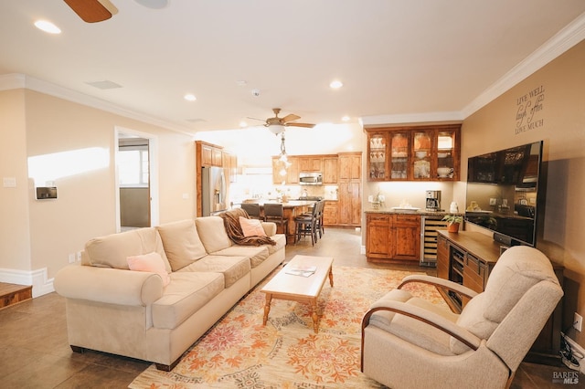 living room featuring crown molding, light tile patterned flooring, wine cooler, and ceiling fan