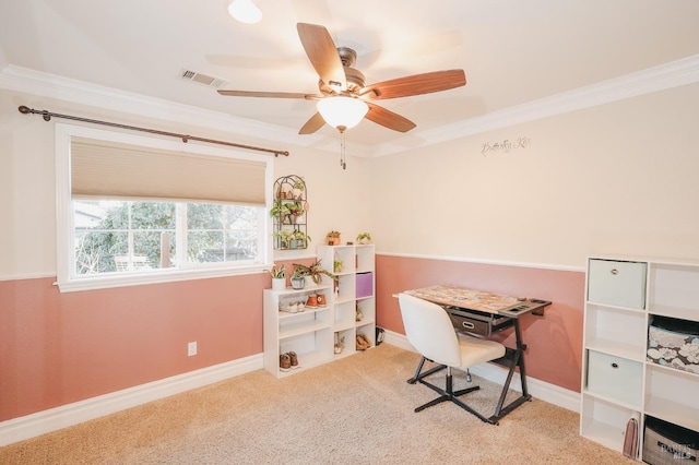 carpeted office featuring crown molding and ceiling fan