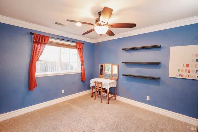 carpeted office with crown molding and ceiling fan