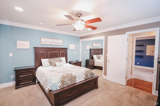 bedroom featuring light carpet, ornamental molding, and ceiling fan