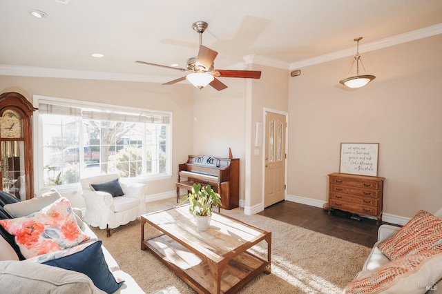 living room featuring vaulted ceiling, ornamental molding, and ceiling fan