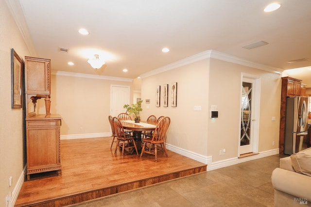 dining room featuring ornamental molding