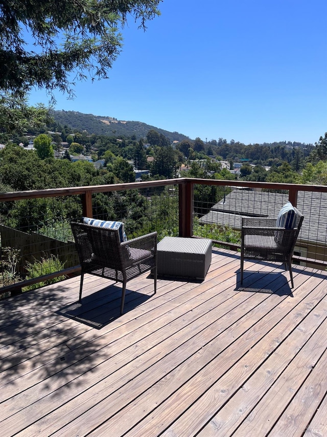 wooden deck featuring a mountain view