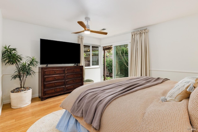 bedroom featuring ceiling fan and light hardwood / wood-style floors