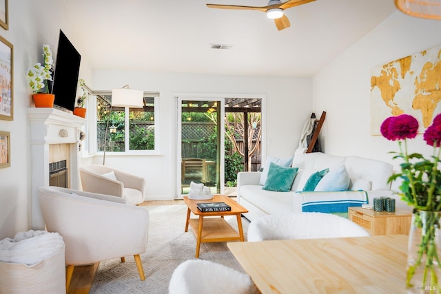 living room with ceiling fan and hardwood / wood-style floors