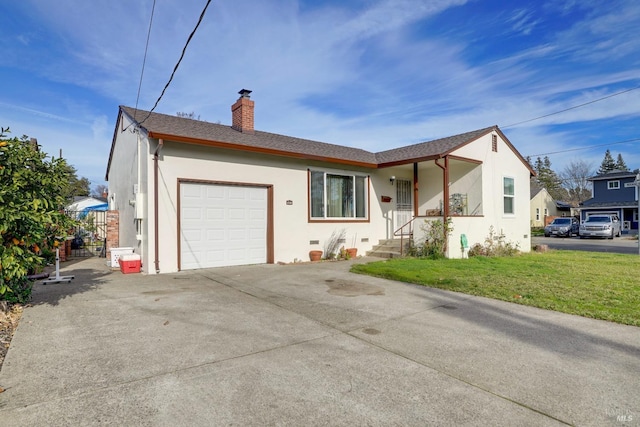 view of front facade with a front lawn and a garage