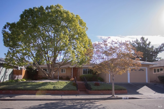 ranch-style house featuring a garage