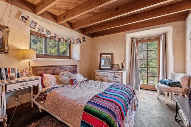 bedroom with light colored carpet, beam ceiling, and wood ceiling