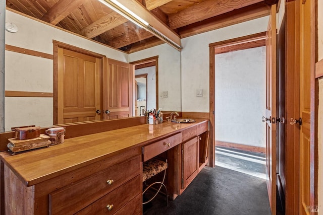 bathroom with vanity, beamed ceiling, concrete floors, and wooden ceiling