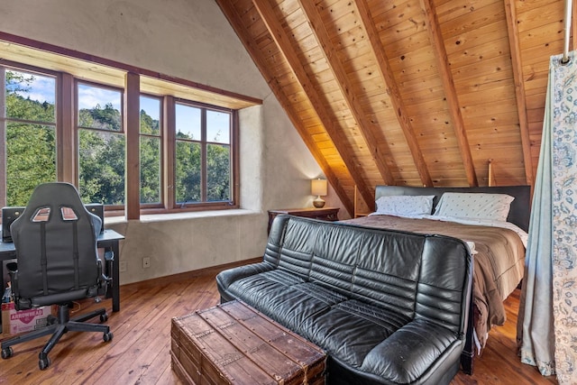 bedroom with vaulted ceiling with beams, wooden ceiling, and wood-type flooring