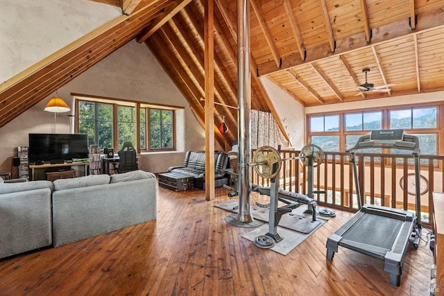 exercise room featuring high vaulted ceiling, wooden ceiling, wood-type flooring, and ceiling fan