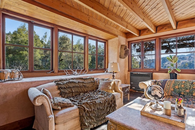 sunroom with beam ceiling and wood ceiling