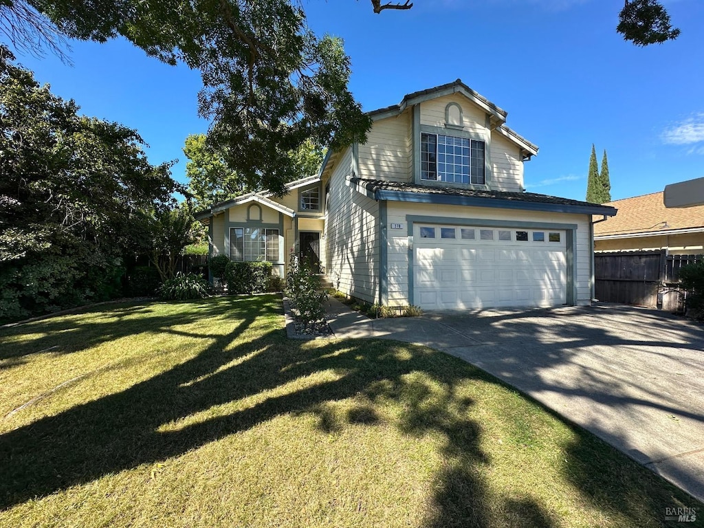 view of front property with a front lawn and a garage