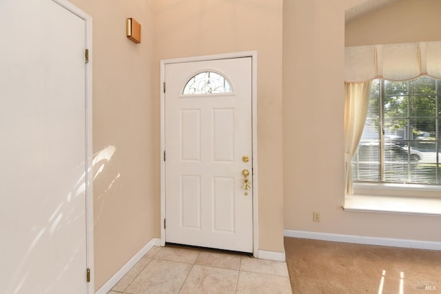 entryway with light tile patterned floors