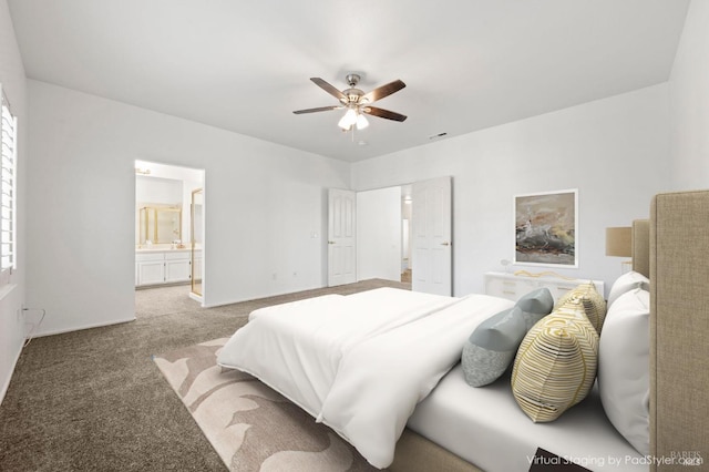 bedroom with ceiling fan, carpet, connected bathroom, and baseboards