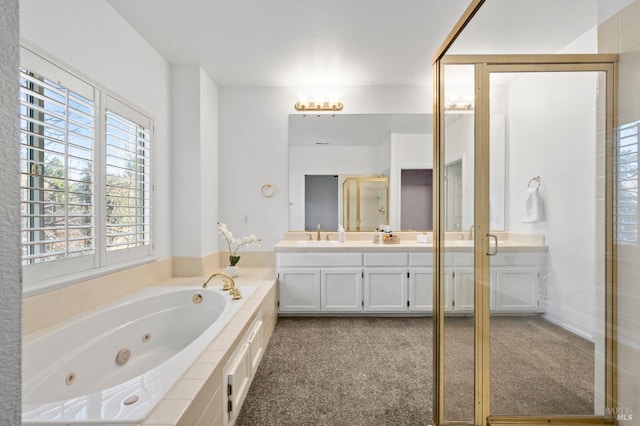 bathroom with a stall shower, a sink, a whirlpool tub, and double vanity