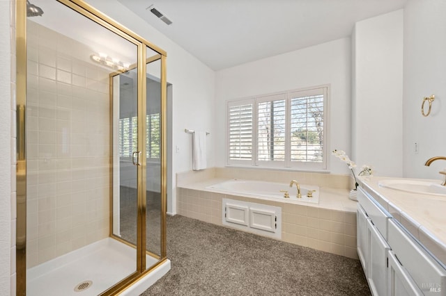 bathroom with independent shower and bath and vanity