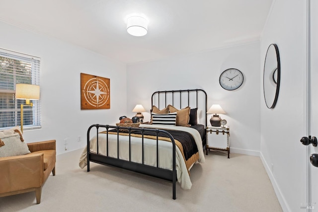 carpeted bedroom featuring baseboards