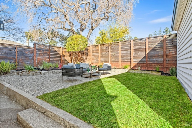 view of yard with an outdoor living space, a patio area, and a fenced backyard