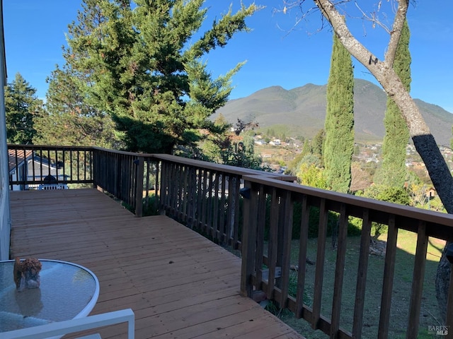 wooden terrace featuring a mountain view